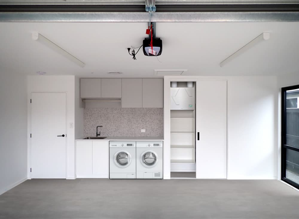 Vertical Lossnay ventilation system installed in a garage